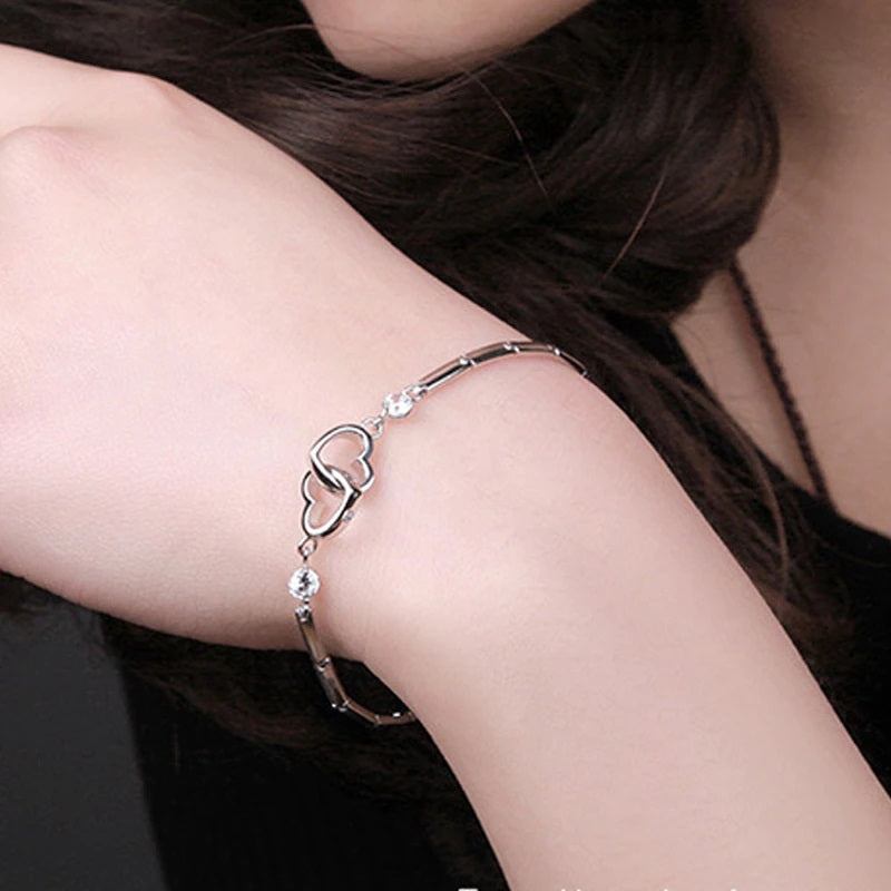 Mother daughter bracelet — two interlocked hearts worn on a wrist