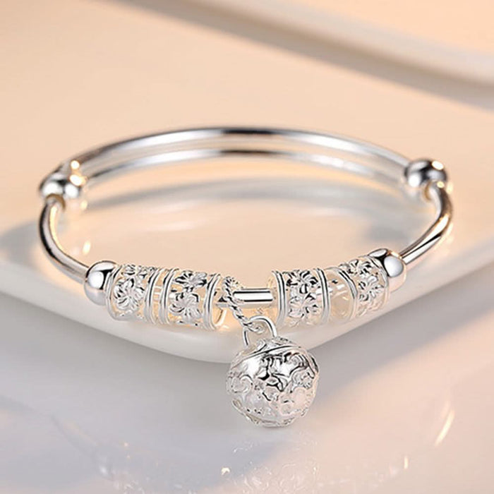 Elegant Dream Catcher Bracelet — filigree web medallion with feather charms
